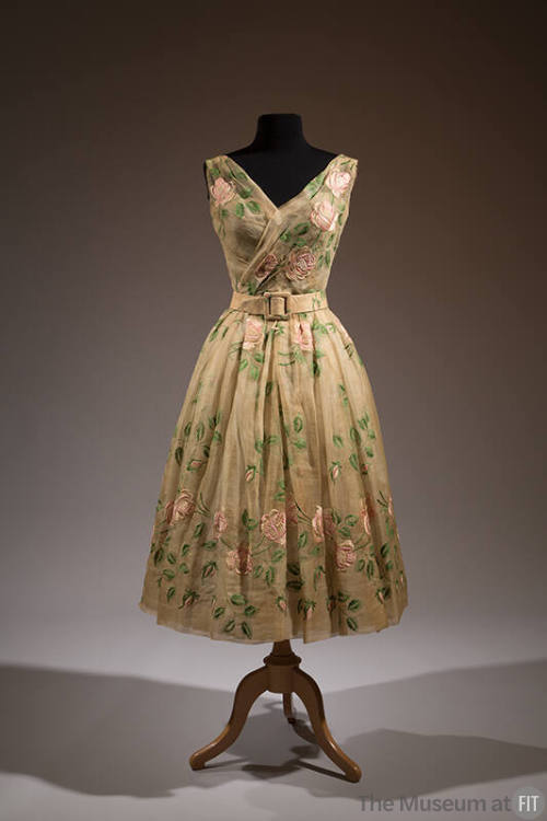Off-white two-piece sleeveless, v-neck dress embroidered with green and pink roses with matchin…
