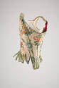 Side view of multicolor floral brocade corset stays showing boning and gussets