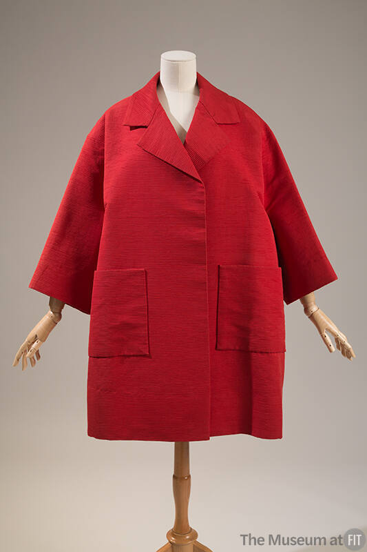 Wide red thigh-length coat with 7/8 sleeves and two large front patch pockets