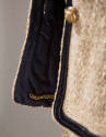 Detail of jacket's navy lining with gold chain