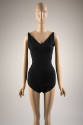 Black fitted V-neck bathing suit with tapered shoulder straps and full coverage bottoms