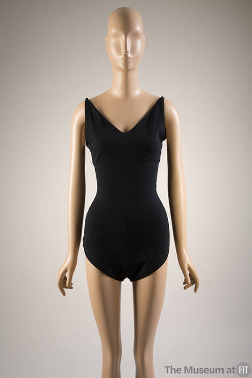 Black fitted V-neck bathing suit with tapered shoulder straps and full coverage bottoms