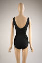 Back view of black fitted bathing suit with scooped back and full coverage bottoms
