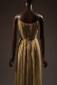 back view of beige crystal pleated full length dress with spaghetti straps, long wrap, and tie …