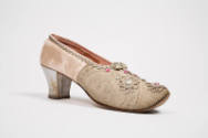 Pink heeled slipper with upturned toe and clear and red rhinestone ornaments