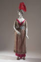 Silver tunic and red trousers; turban with red feather, slippers, fake scimitar
