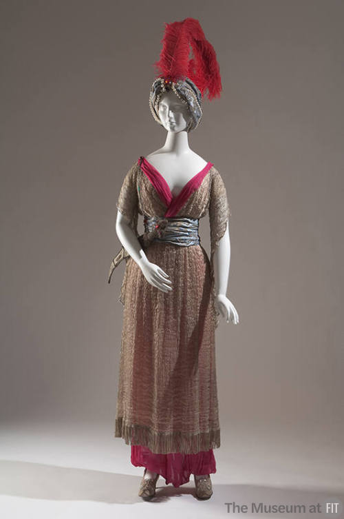 Silver tunic and red trousers; turban with red feather, slippers, fake scimitar