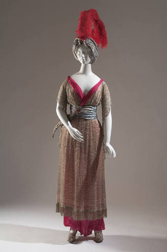 Silver tunic and red trousers; turban with red feather, slippers, fake scimitar