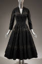 Black ankle length cocktail dress with horizontal bands of rhinestones, ¾ sleeves, V-neckline, …