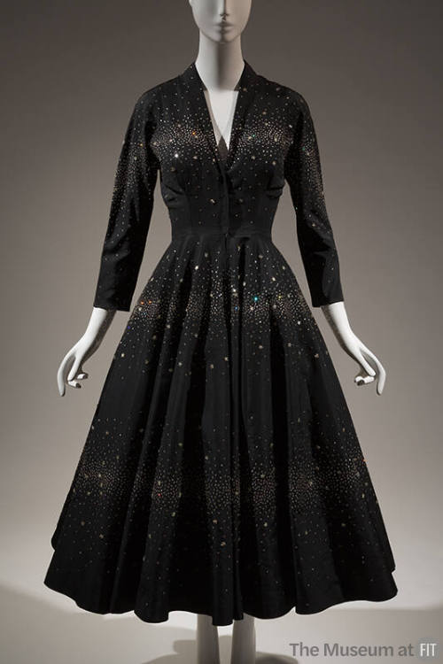 Black ankle length cocktail dress with horizontal bands of rhinestones, ¾ sleeves, V-neckline, …