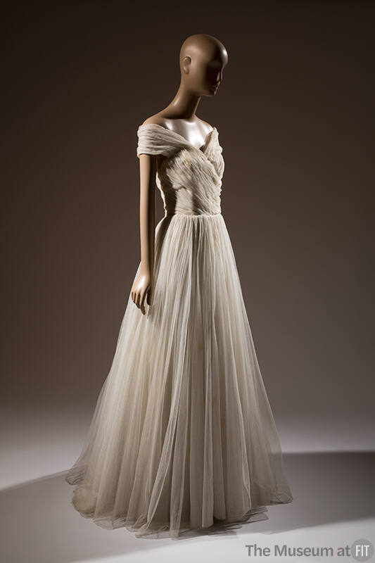 Ivory tulle floor length ballgown with off-the-shoulder halter style bodice and full skirt