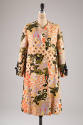 White linen coat printed with winged animal design in black, gold, mauve pink interspersed with…