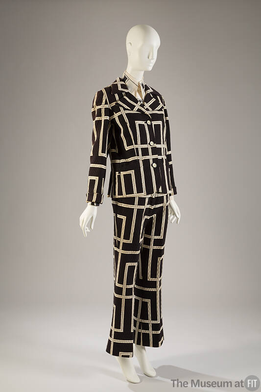 Black jacket, skirt, and pants with quilted texture and large white geometric linear design