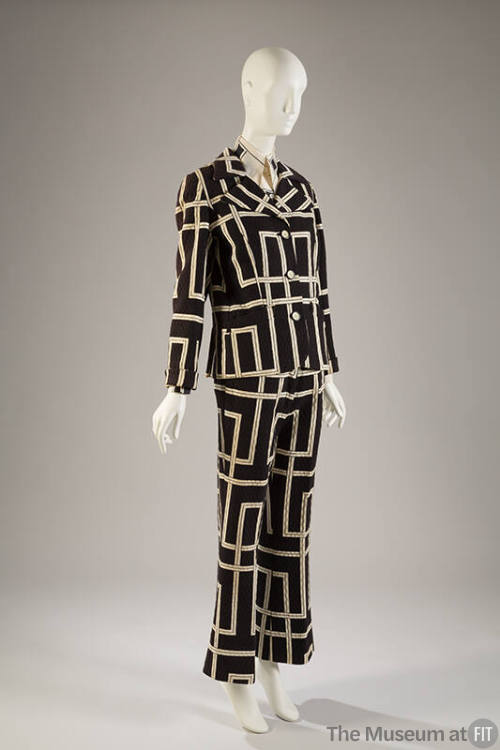 Black jacket, skirt, and pants with quilted texture and large white geometric linear design