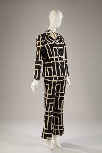 Black jacket, skirt, and pants with quilted texture and large white geometric linear design