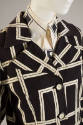 Black jacket with quilted texture and large white geometric linear design and cooridnating shir…