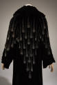 Back view of black evening coat with comet design in crystal seed beads and rhinestones