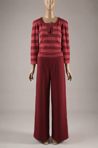 Red and pink horizontally striped sweater with red straight leg pants
