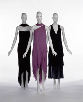 Two black evening dresses and one purple evening dress with asymmetrical hem, all sleeveless