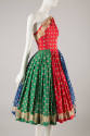 Red, green, and blue dress with spaced print in yellow, red, blue, and black; fitted one should…