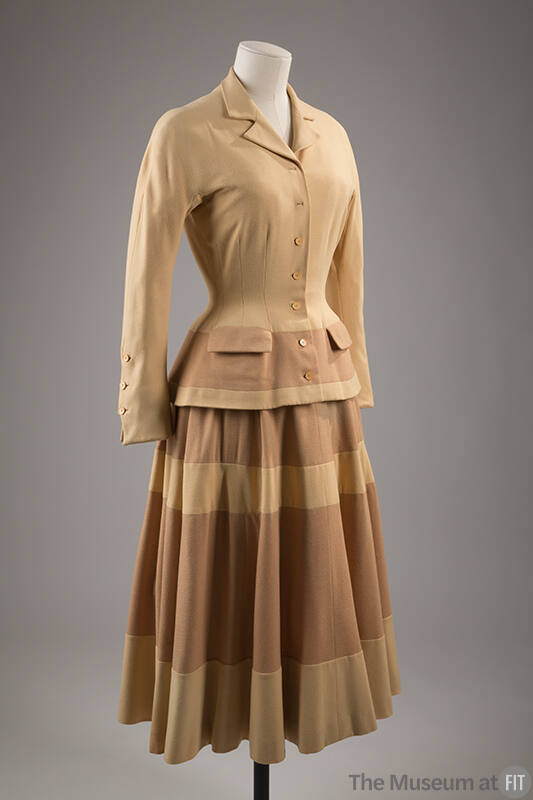 Light yellow fitted suit jacket with banded tan and yellow skirt