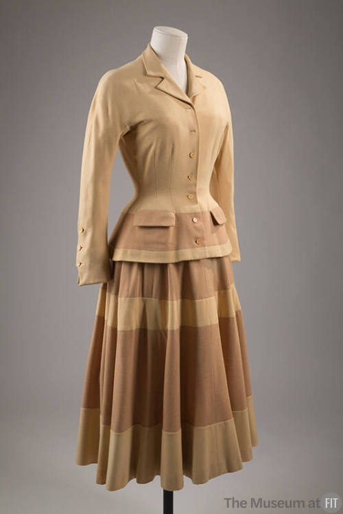 Light yellow fitted suit jacket with banded tan and yellow skirt