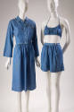 Blue chambray beach coordinates on two mannequins: cropped button front jacket with knee length…