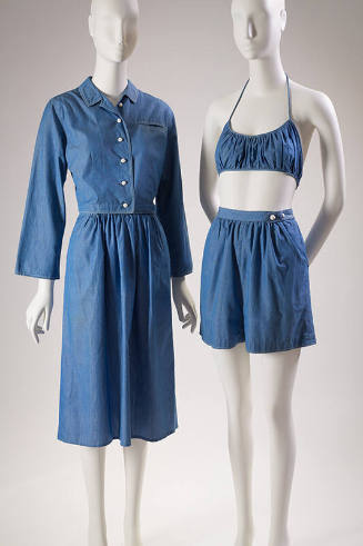 Blue chambray beach coordinates on two mannequins: cropped button front jacket with knee length…