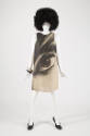 Eveball print dress shown on a mannequin with black afro wig, black and white bracelet and blac…