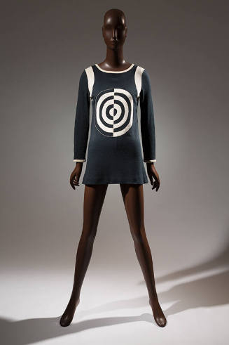 Black long sleeve mini dress with black and white target design on center chest