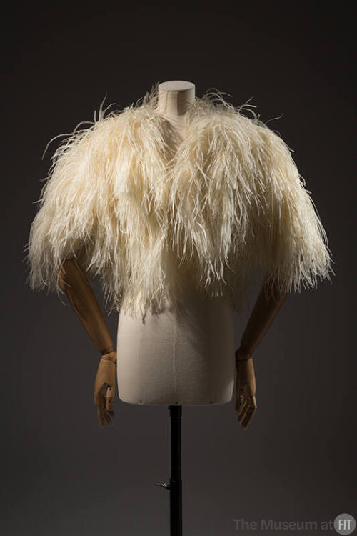 White ostrich feather bolero with feathers touching to elbows