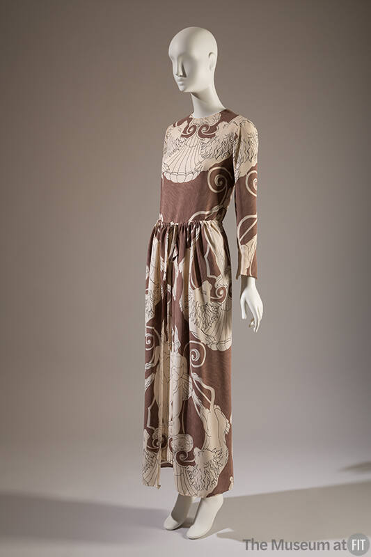 Taupe floor length shift and panel overskirt printed with white symmetrical linear drawing of c…