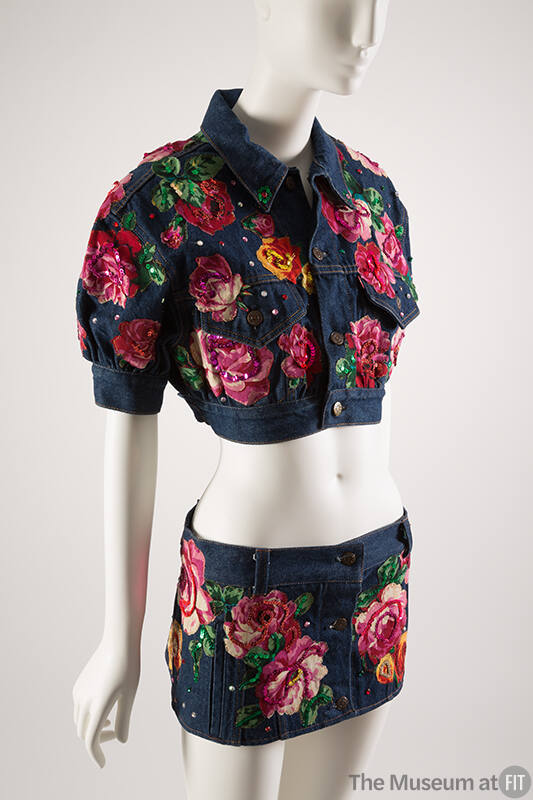 Blue denim cropped jacket and matching mini skirt with rose appliqués, sequins and rhinestones …