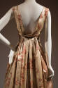 Back draped detail of beige floral dress