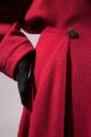 Front pleat and button detail of red coat
