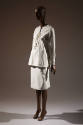 White lace-up tunic top and white to-the-knee skirt 