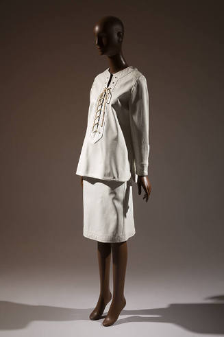 White lace-up tunic top and white to-the-knee skirt 