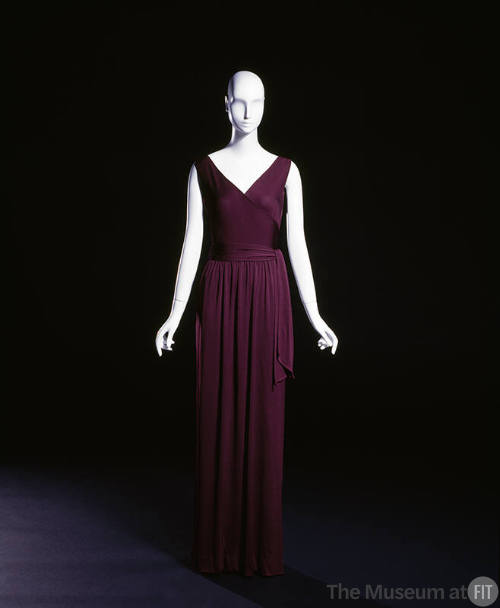Purple sleeveless floor length gown with tie sash 