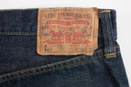 Detail of jeans back tan Levi's patch trademark label and belt loop
