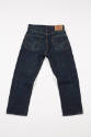 Back view of blue denim jeans with top stitched patch pockets, tan trademark label at waist and…