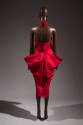 Back view of red halter top dress with back draped extended hip panels