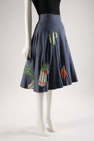 Blue denim flared skirt scattered with printed and stuffed vegetable appliqués