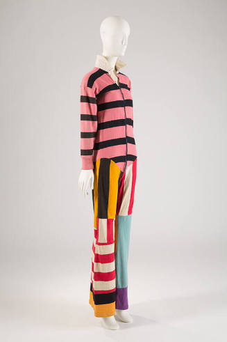 Pink, black, yellow, red, and blue long sleeve jumpsuit with patchwork striped sections