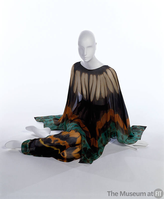 Orange, off-white, black, green / blue poncho with long sleeves and matching pants