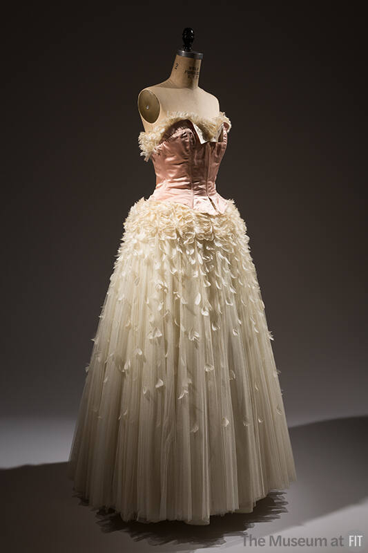 Strapless evening dress with pink satin corset bodice and off-white full skirt  trimmed with  f…