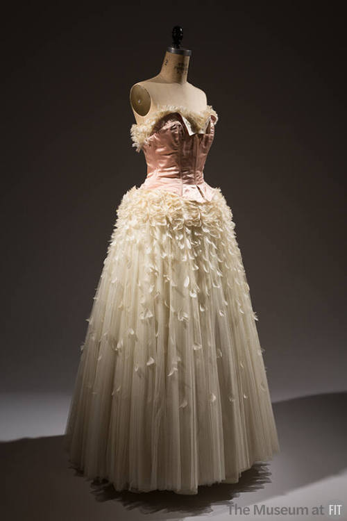 Strapless evening dress with pink satin corset bodice and off-white full skirt  trimmed with  f…