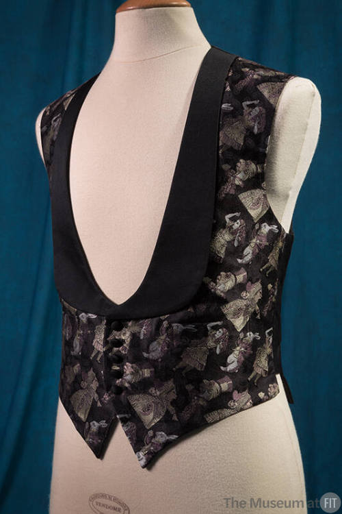 Man’s black jacquard vest with Alice in Wonderland design in light purple, beige and white, wit…