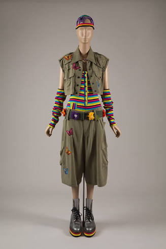 Ensemble of olive green vest and shorts, rainbow striped union suit and matching separate sleev…
