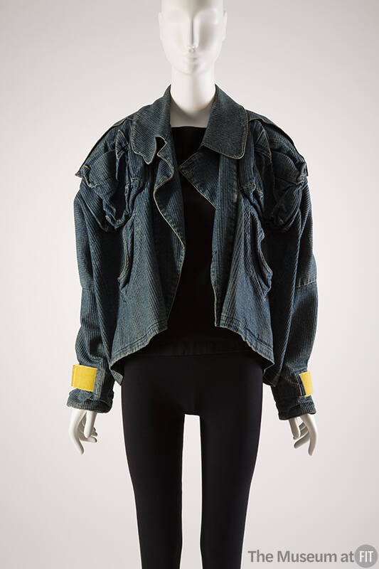 Wide cut jeans jacket with yellow Velcro tabs at sleeve edges