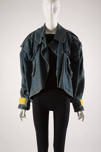 Wide cut jeans jacket with yellow Velcro tabs at sleeve edges